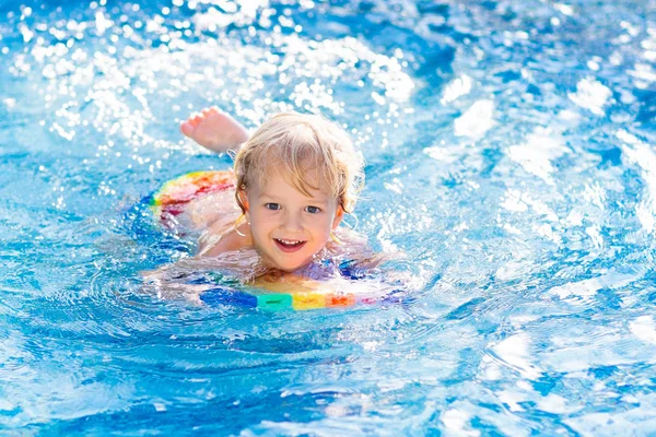 depositphotos_271781378-stock-photo-child-learning-to-swim-kids